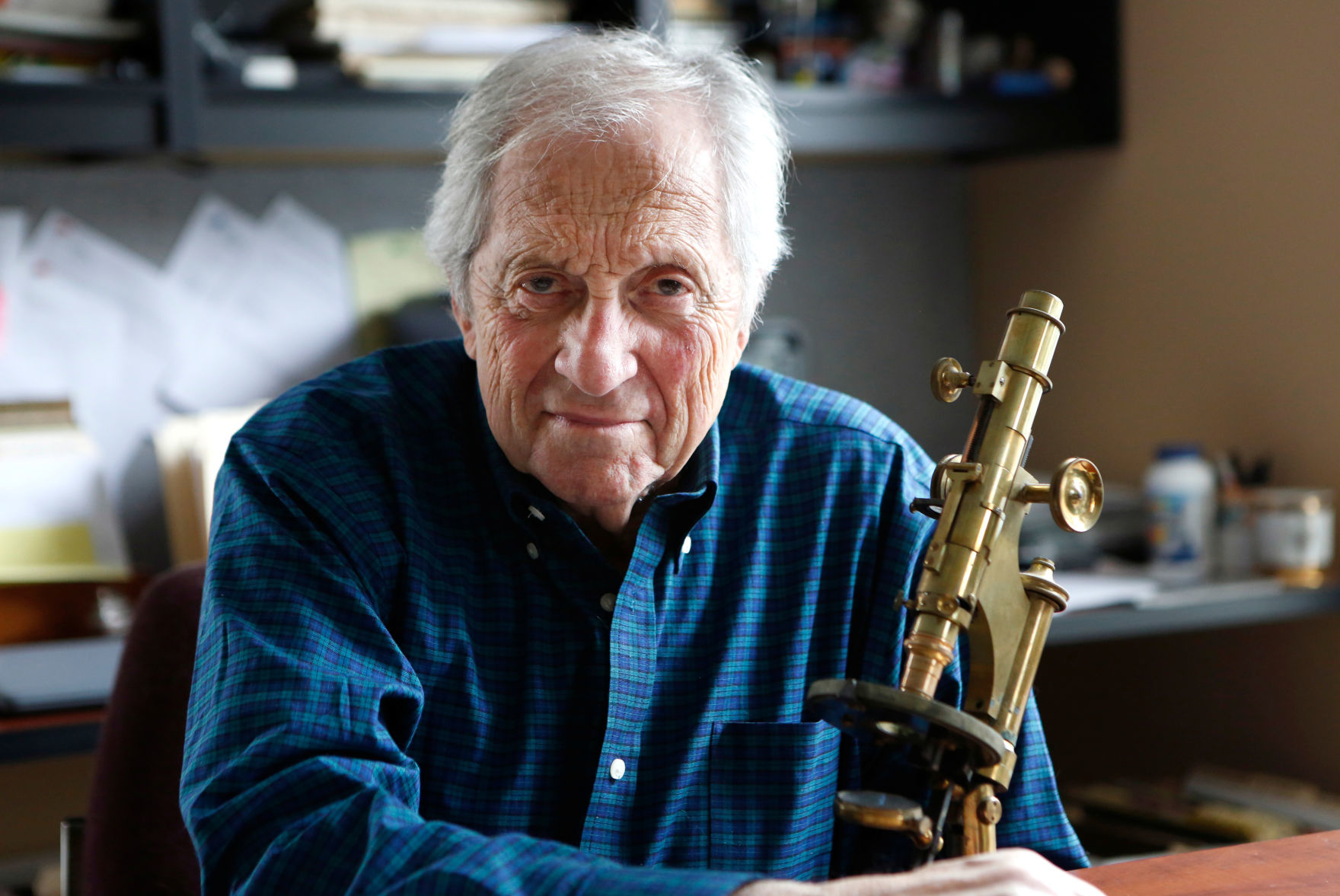 Dr. Arthur Langer poses for a portrait in his home in Williamsburg